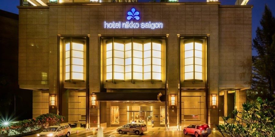 Exterior view of the Hotel Nikko Saigon, showcasing its architecture and surroundings.